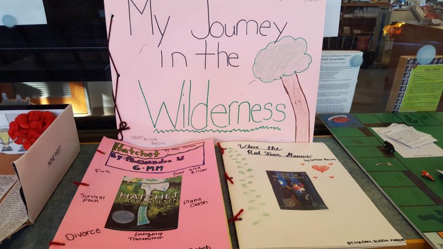 Some students created photo albums to represent important events in their adventure fiction novel. The photo albums incuded pictures, either original or printed, and captions that explained the pictures relevance in the story.