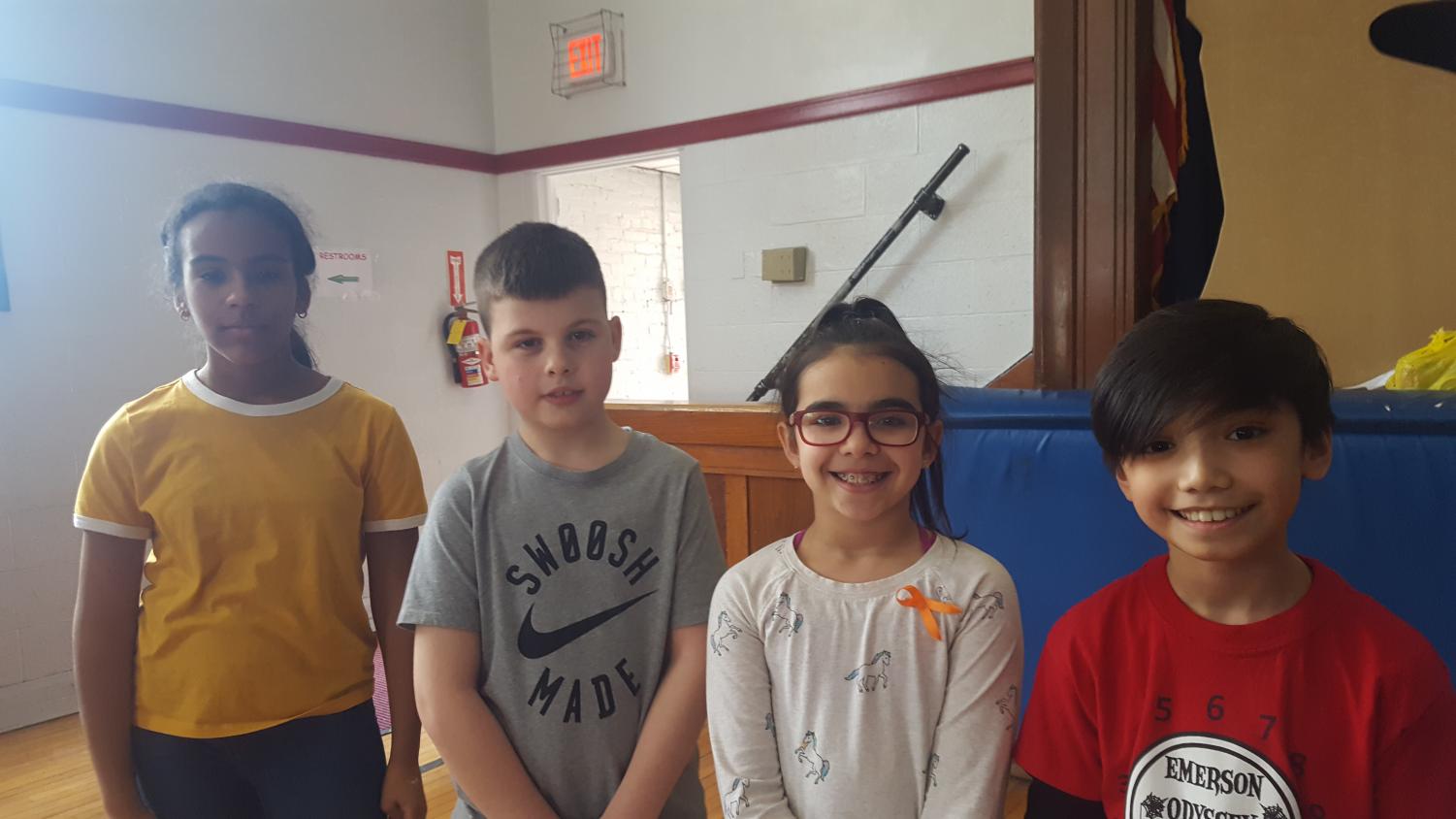 Student Congress recognized these art contest winners during a recent Mr. O. Show. One winner was announced from each grade. Pictures from left to right are Marileidy Buffa, grade 6; Hugh Hennessey, grade 5; Dani Dominguez - 4th grade; Daniel Acosta, grade 3.