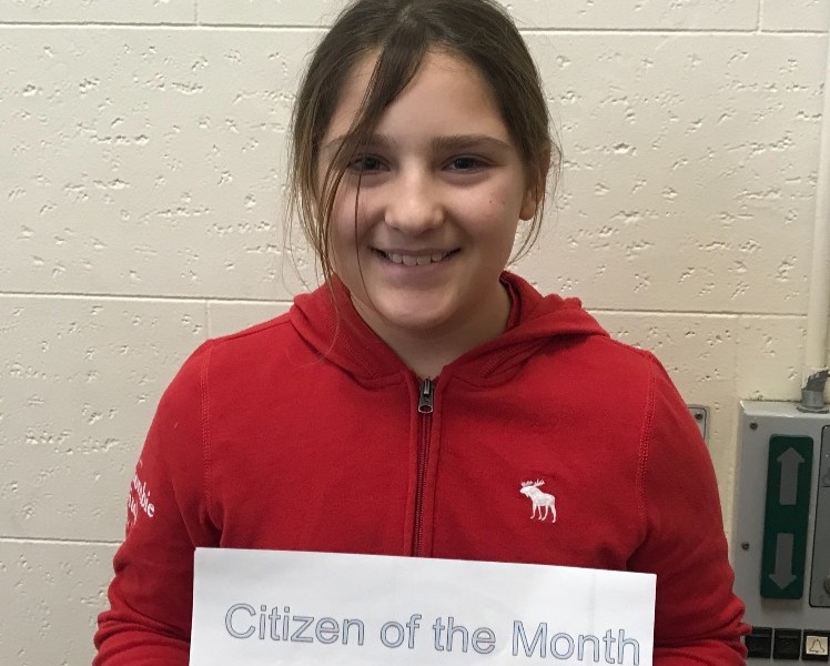 Allie DeOrio beams with excitement for being recognized as Citizen of the Month  in 4th grade. She earned the title for being caring to classmates.