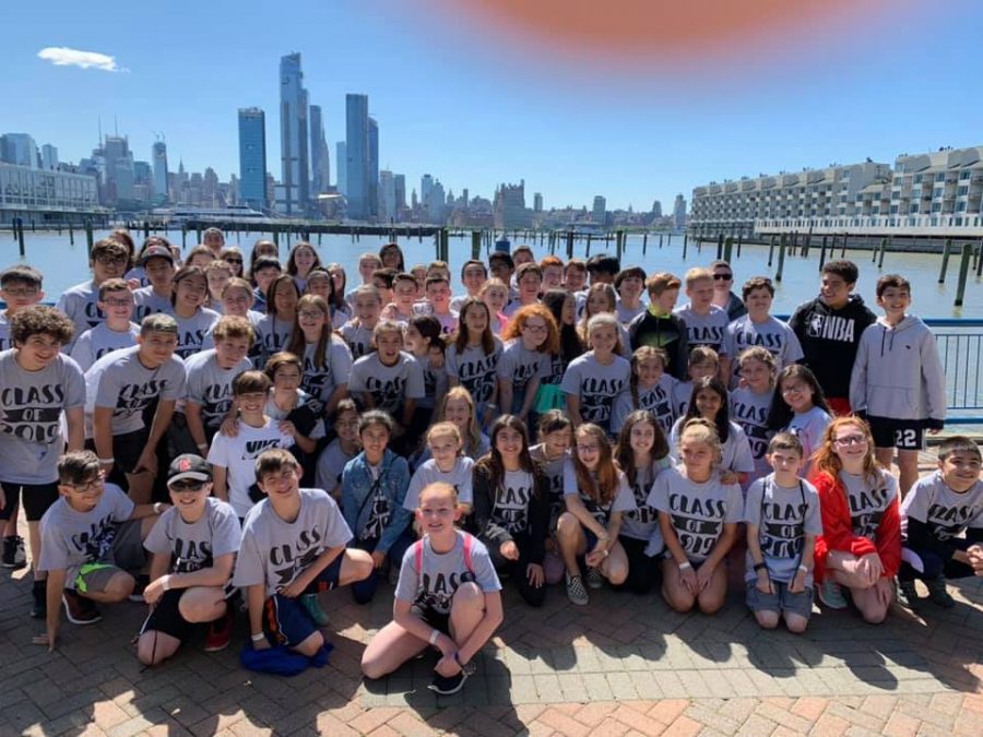 Sixth graders gather before boarding the Spirit of New Jersey boat for a class photo. The boat ride along the Hudson River is the annual end-of-year field trip for the grade.