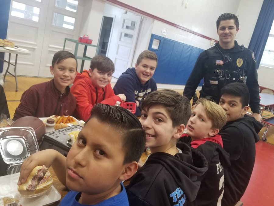After spending time with the students in the classroom and at recess, Emerson police officers lunched with sixth graders.