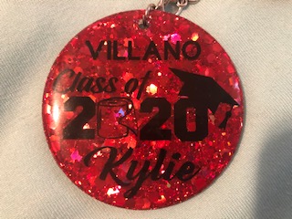 Although the sixth-grade class is not getting the same graduation as the past years they are still making it memorable. This student got a key chain to remember this unique graduation and all the fun she had at Villano.