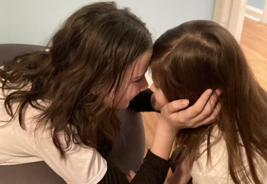 A loving stare between sisters turned into a playful wrestling match at home. Sixth grade Science teacher Elizabeth McClafferty said she enjoyed such moments with her daughters during the recent winter recess.