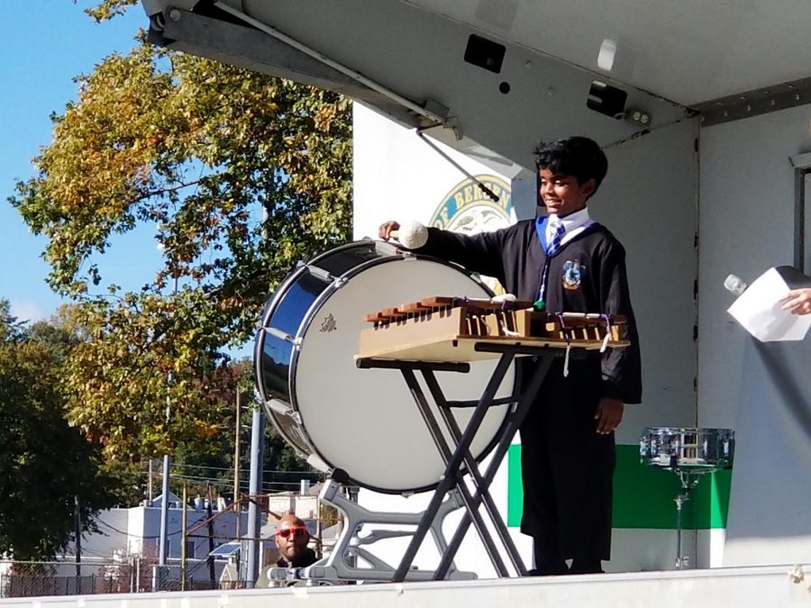 A member of the school band demonstrates his percussion skills at a recent Mr. O. Show. Thats a monthly show where students display their unique talents.