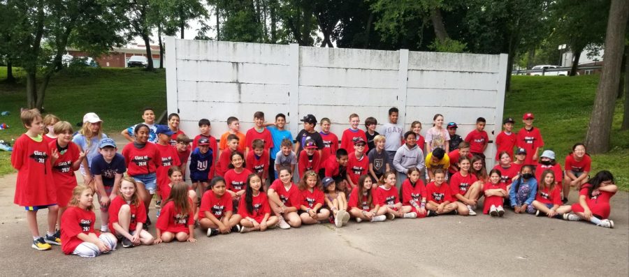 Fourth graders celebrate their end of year with outside time on the lower field.