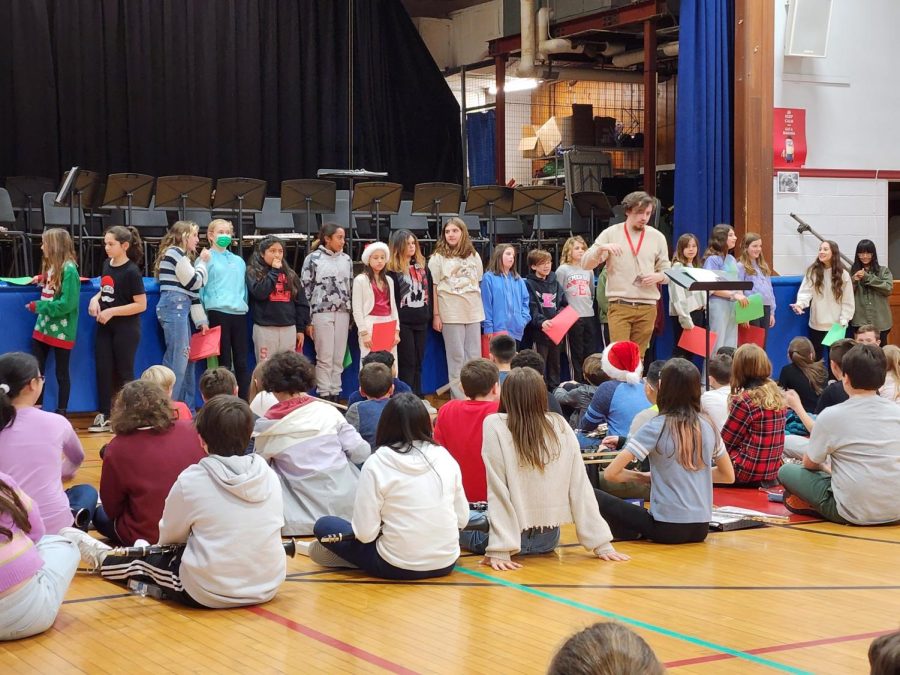 Joseph Gibbs directs chorus students at Patrick M. Villano School during a rehearsal for the Winter Concert.