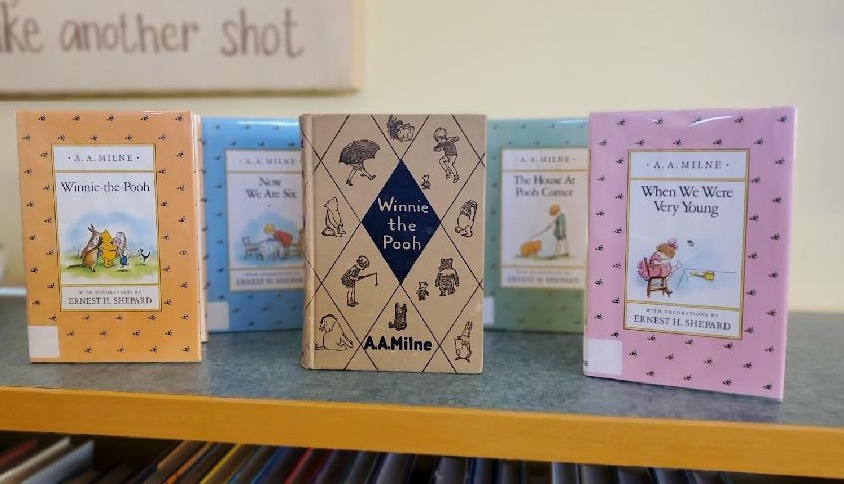 Winnie the Pooh books sit on display to honor the character turning 100 years old.