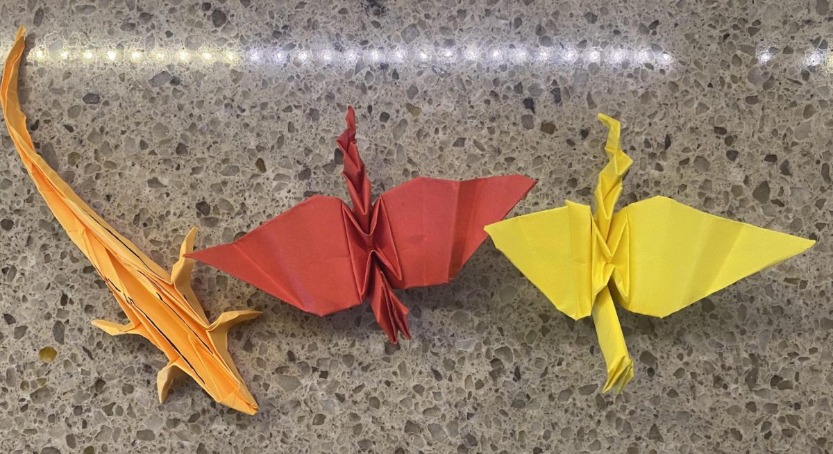 Here are three of Smith's completed Origami masterpieces. The orange Origami is a lizard, and the other two are unknown.