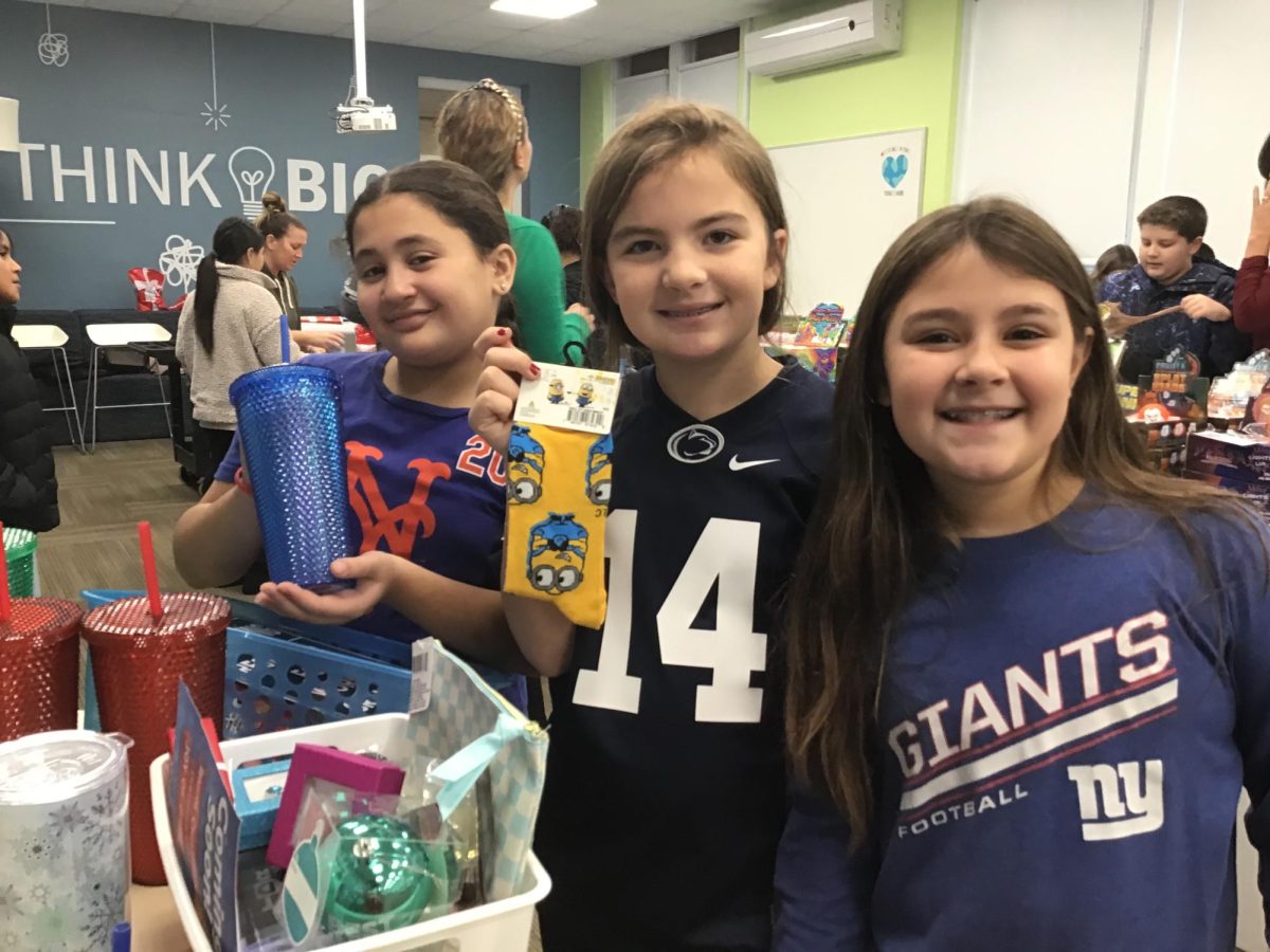 Fifth grade students enjoy purchasing small items for family members at the annual Holiday Shoppe.