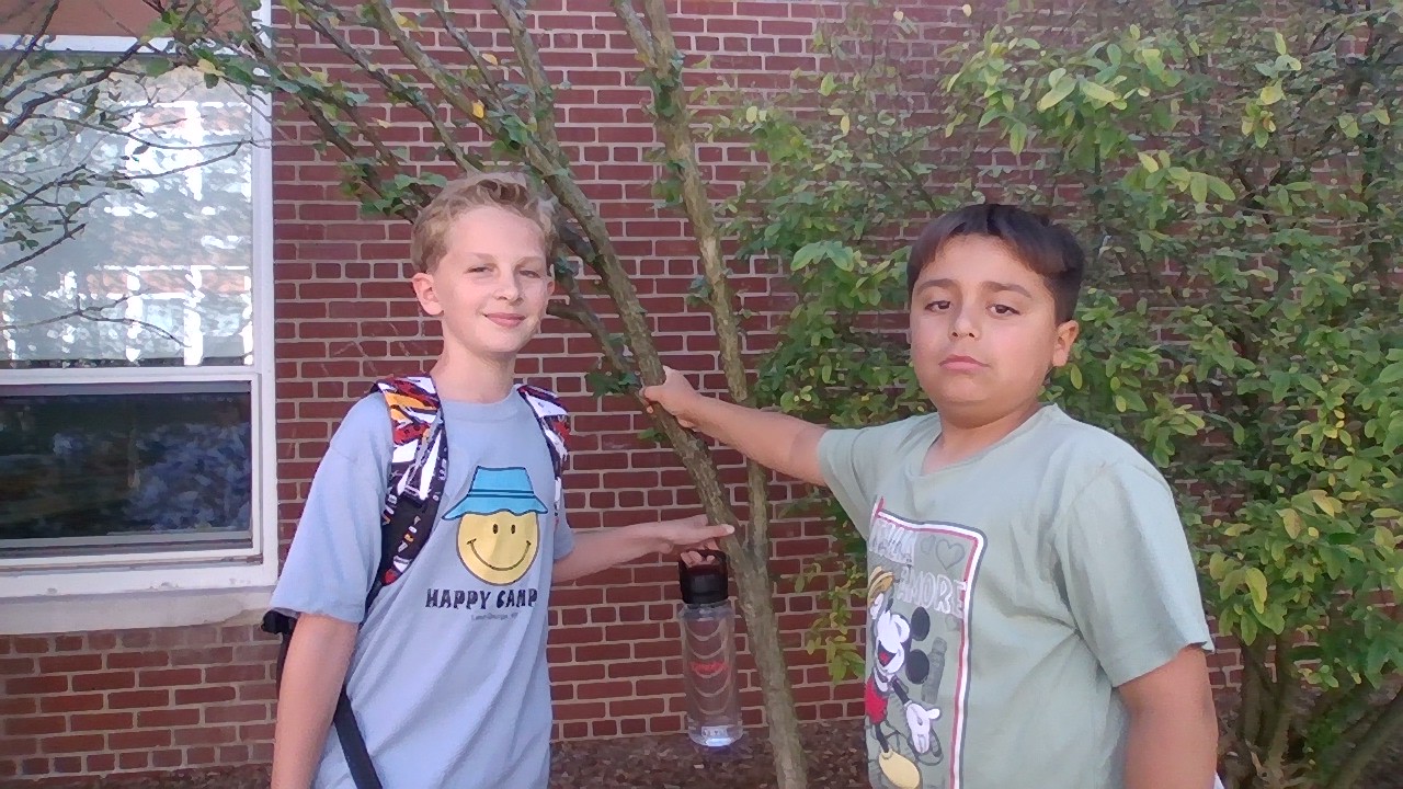 These fourth graders are waiting to enter school in the morning. All classes line up in the courtyard.