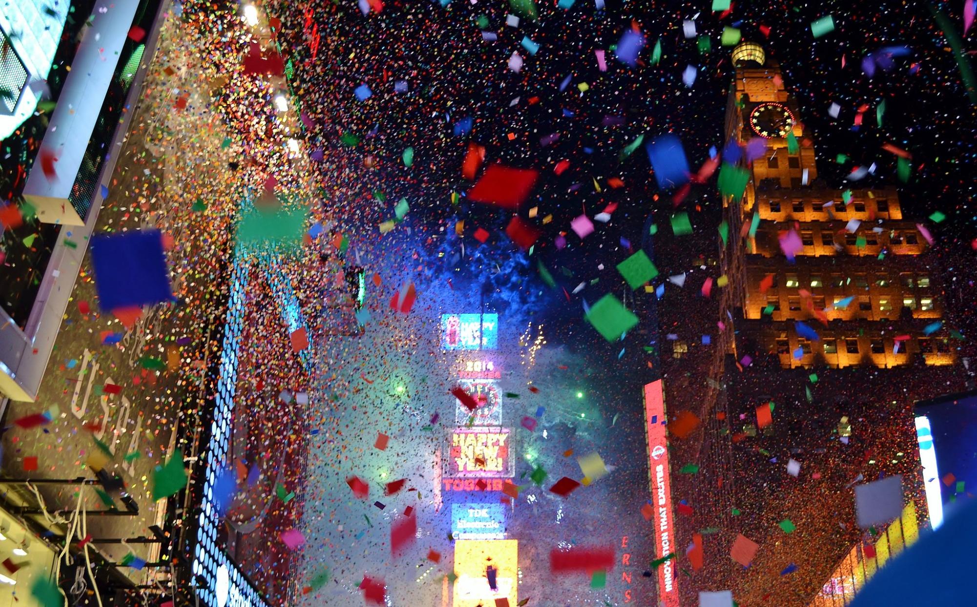 New Year's Eve in Times Square with comfetti and the ball drop at midnight.