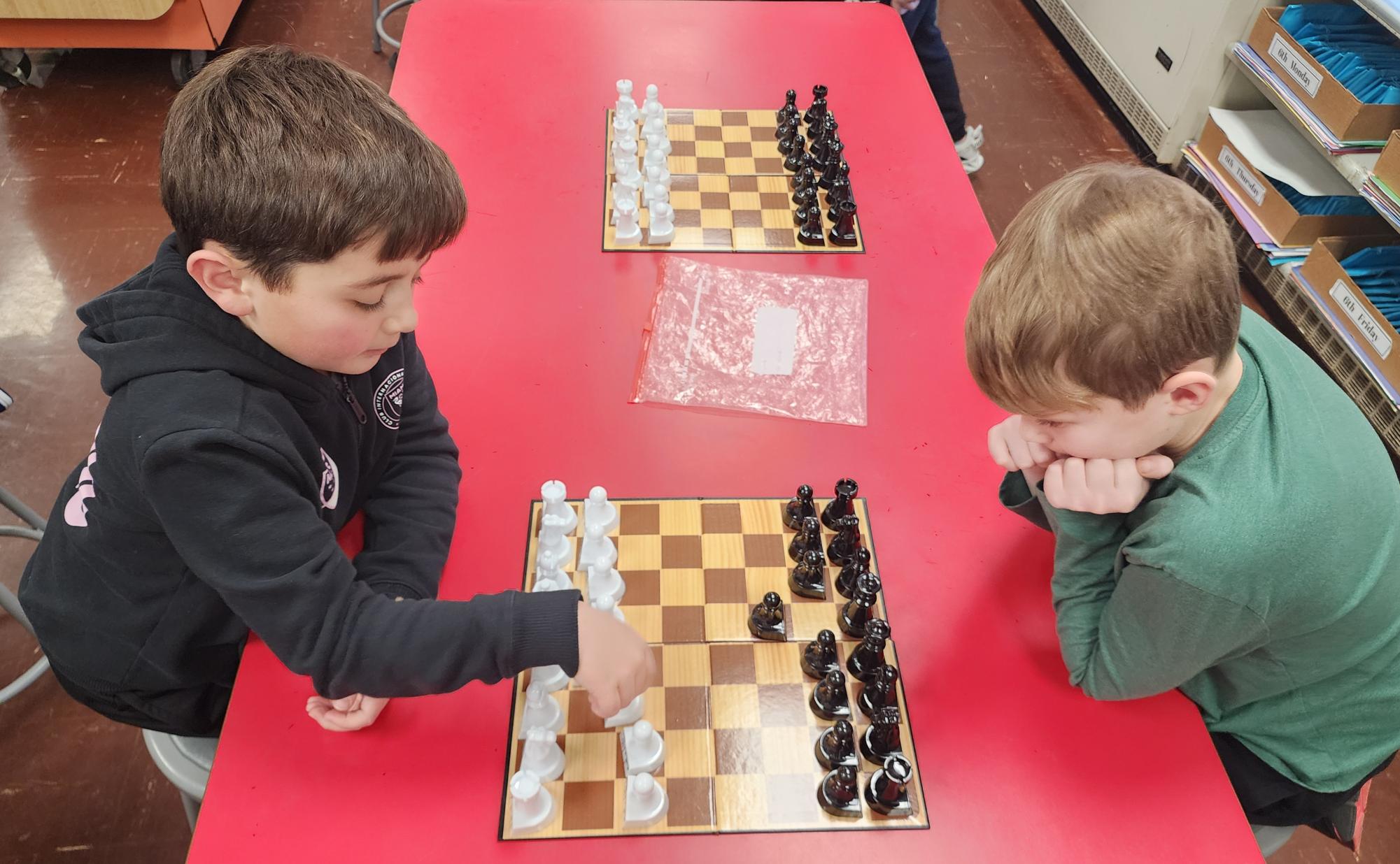 The Chess Club starts with a short strategy lesson each session. Then, there's free play for its members.