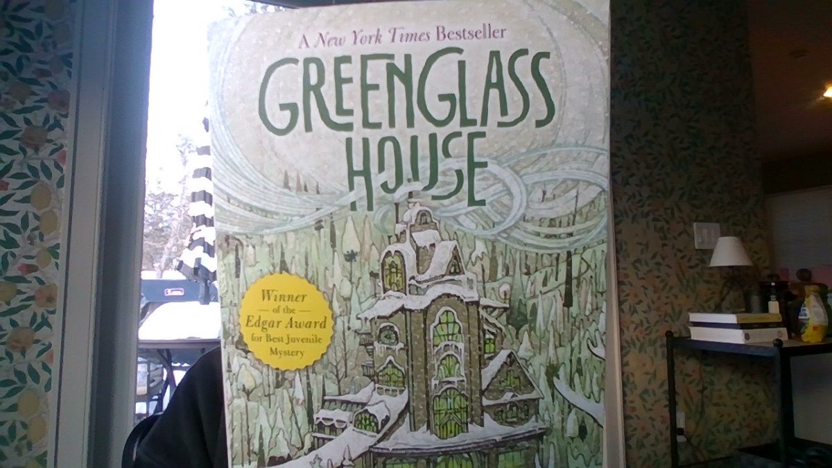 The cover of the book The Greenglass House features a building where all the stories take place. This book won the Edgar Award for being the best mystery book.