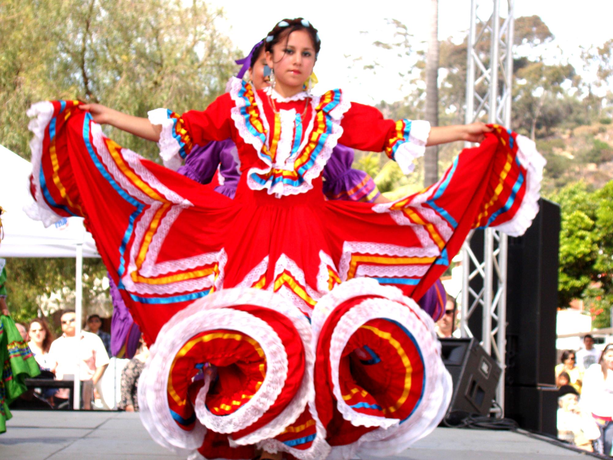 People wear colorful dresses and dance during Cinco de Mayo celebrations to honor Mexican culture and traditions, according to National Geographic online.