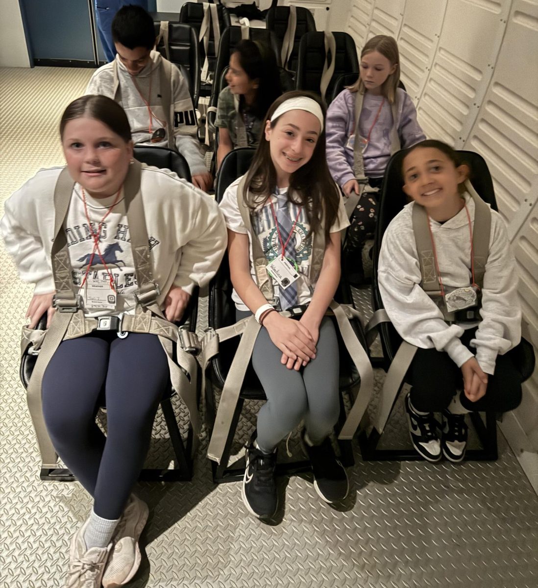 Students spend half their time on the field trip in mission control. The other half of their time  is spent aboard a simulated spacecraft flying to Mars. This group of students enjoyed a pretend spacecraft liftoff.