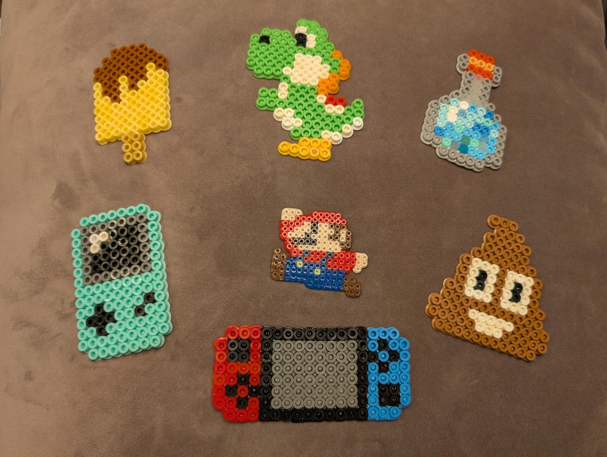 These pixel art creations will be on sale at the TREP$ Marketplace.. They're made from small plastic beads that are arranged on a pegboard and then fused together with heat.