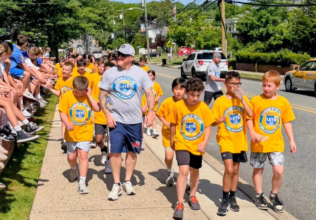 Officers from the Emerson Police Department ran alongside students.