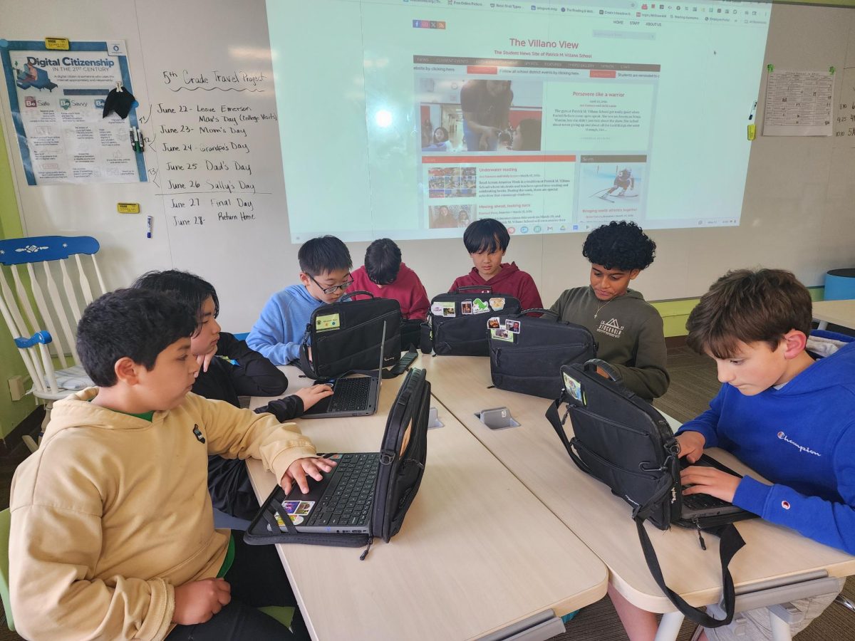 Sixth-grade reporters for the Villano View discuss possible article ideas for the month of June at a recent meeting.